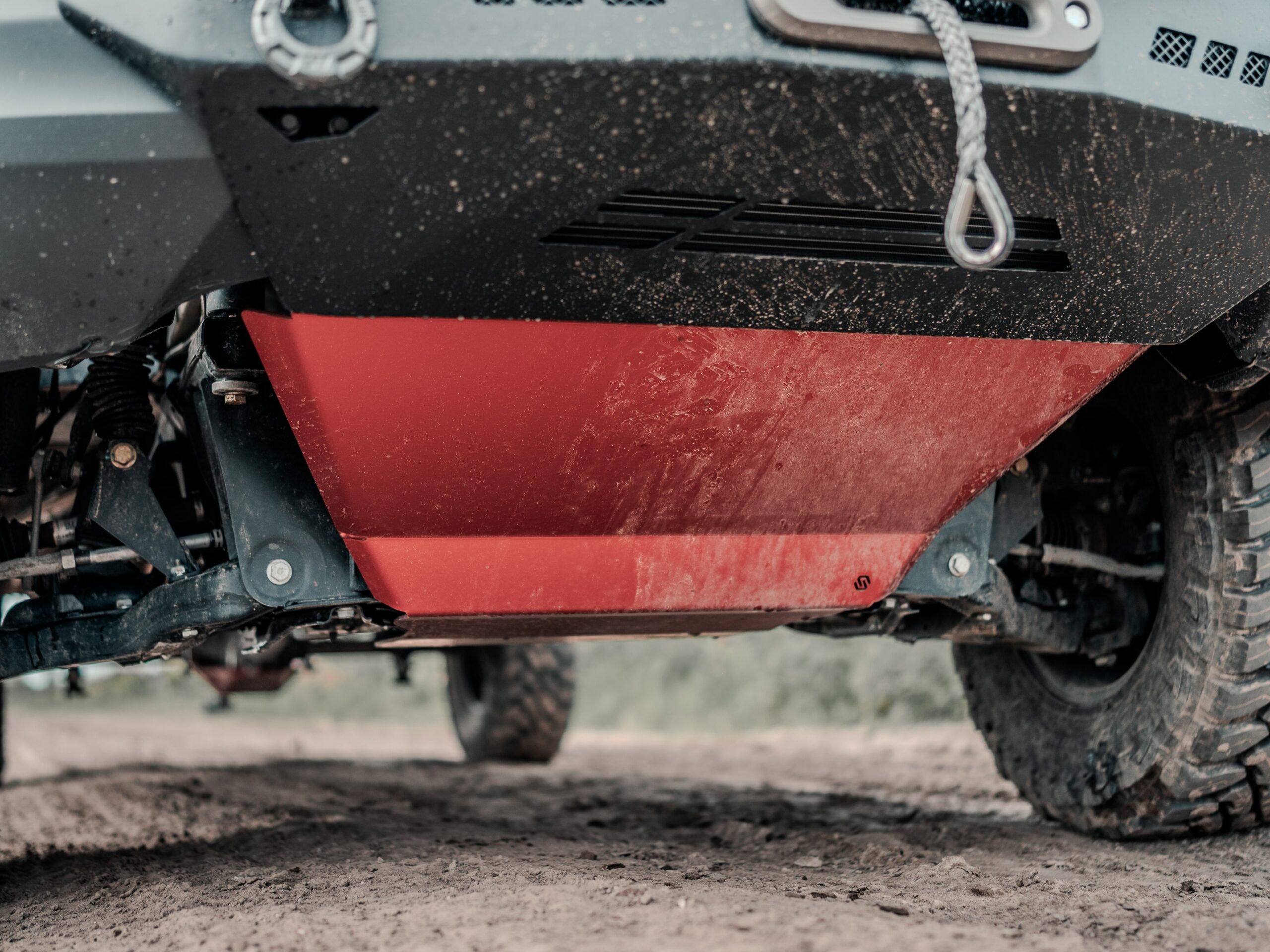 Dark red anodized engine skid plate for mercedes sprinter.